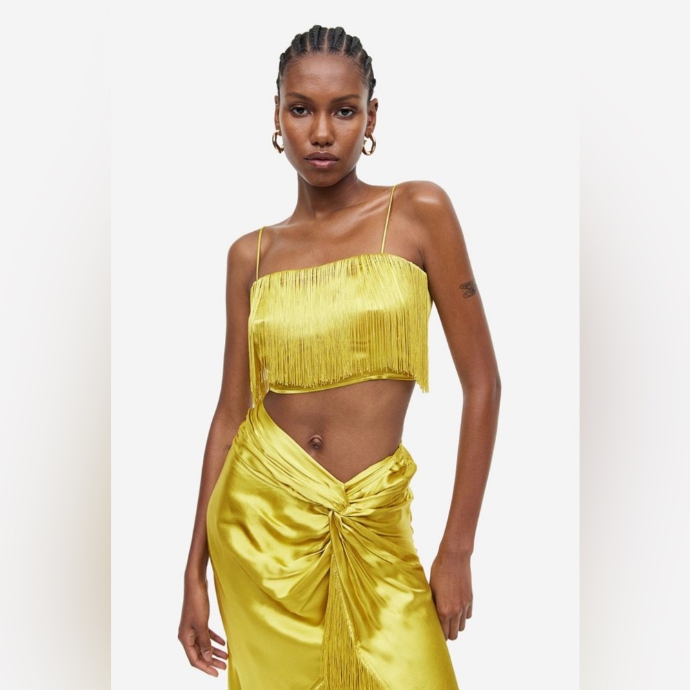Crop top in softly draped viscose satin with long fringe at upper front.